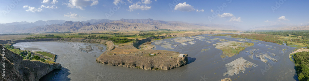 Naklejka premium Panoramic view of the Zeravshan river valley near Panjakent in Sughd province, Tajikistan
