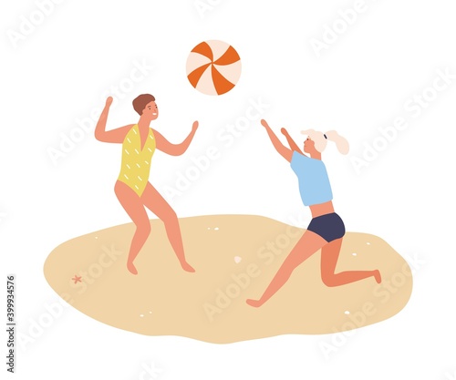 Young women tossing ball on beach. Cheerful people playing volleyball in summ...