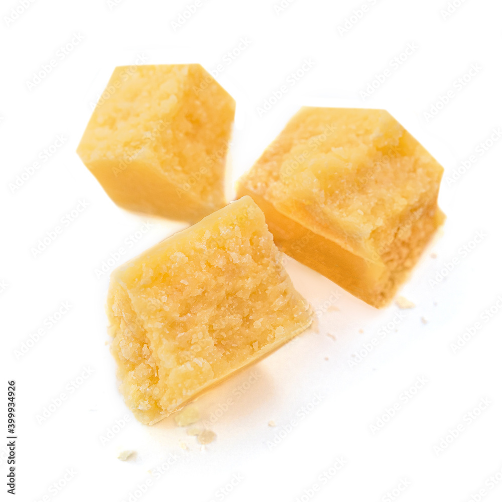 Pieces of Parmesan cheese isolated on white background. Top view.