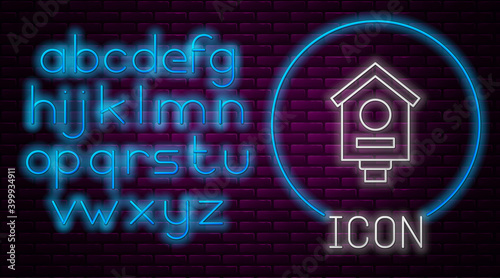 Glowing neon line Bird house icon isolated on brick wall background. Nesting box birdhouse, homemade building for birds. Neon light alphabet. Vector.