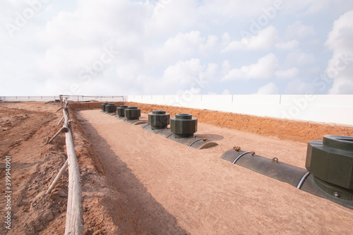 Underground fuel tank installed on site used in gas stations. Large tank for storage of petroleum products. Digging into the soil.