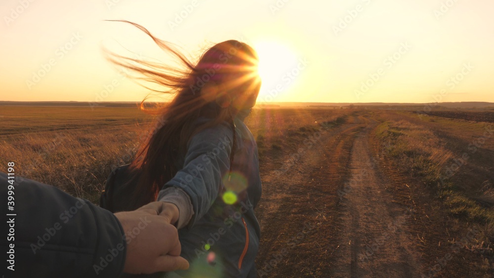 Happy smiling girl walks at sunset and laughs. It's fun to travel together. Camping life. Look for adventure travel. Love for nature and life. Enjoy and breathe fresh air. Evening sports walks in the - obrazy, fototapety, plakaty 