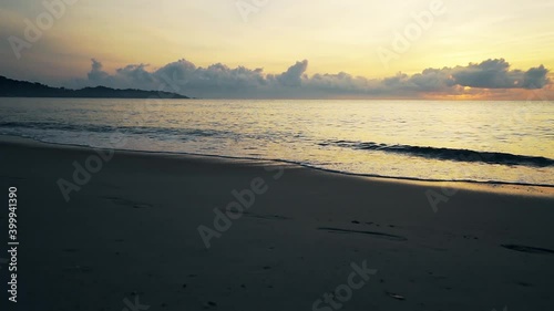Wallpaper Mural Tropical deserted sandy beach at sunrise. The sound of the surf . Slow motion video. Torontodigital.ca