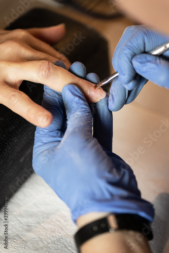 Closeup shot of a woman in a nail salon receiving a manicure