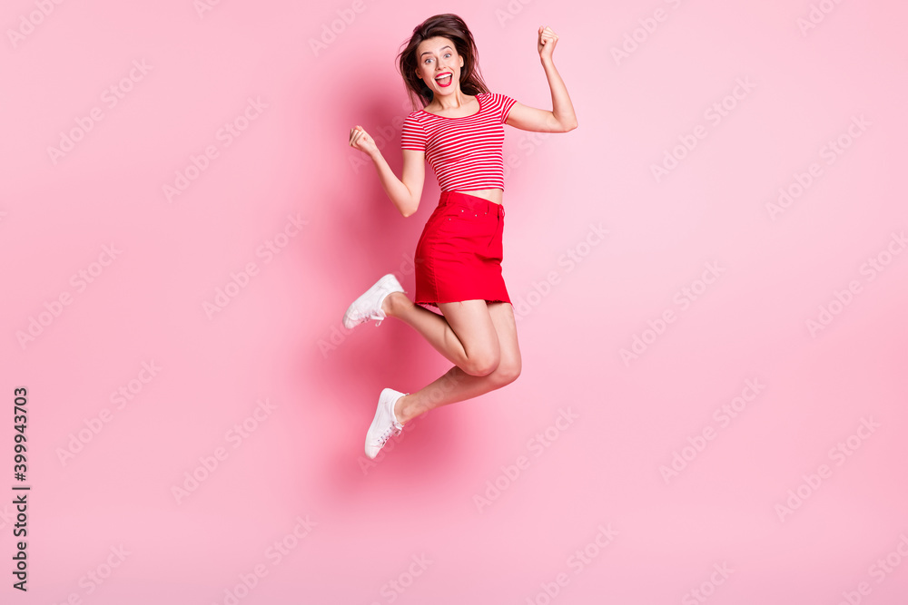 Full size photo of young beautiful cheerful excited positive girl jump in victory isolated on pink color background