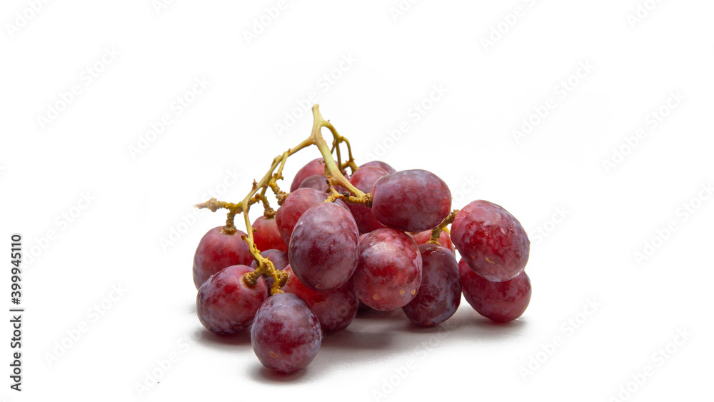 Close up a bunch of fresh red grapes on isolated white background.