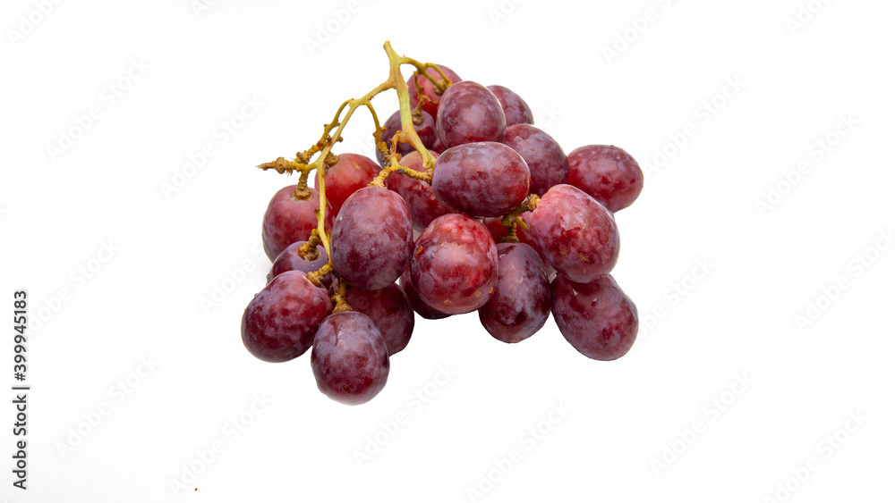 Close up a bunch of fresh red grapes on isolated white background. Close up a bunch of fresh red grapes on isolated white background.