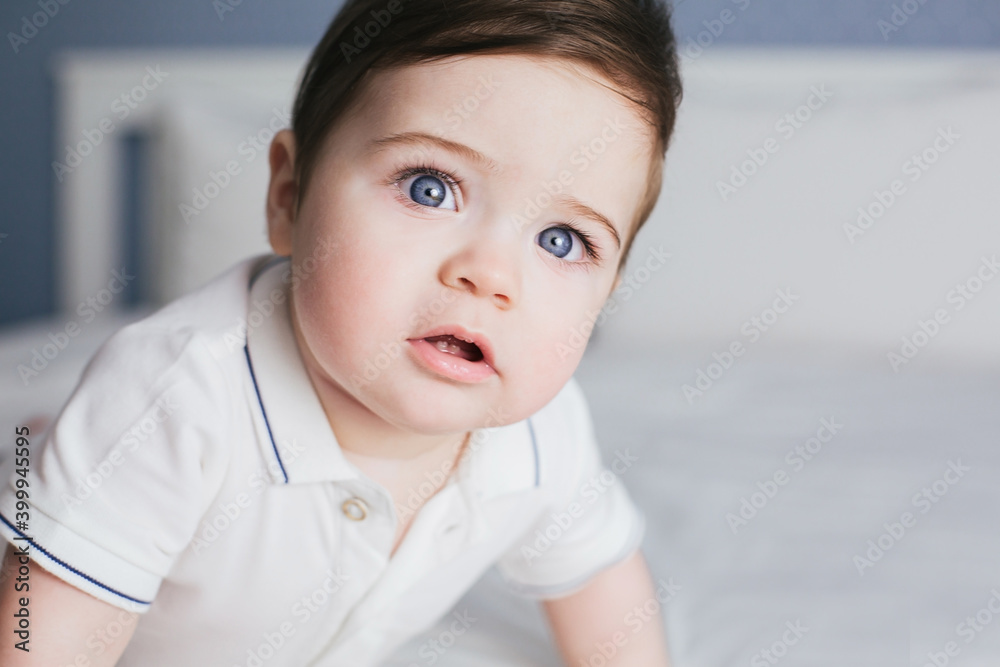 cute baby boy with blue eyes and black hair