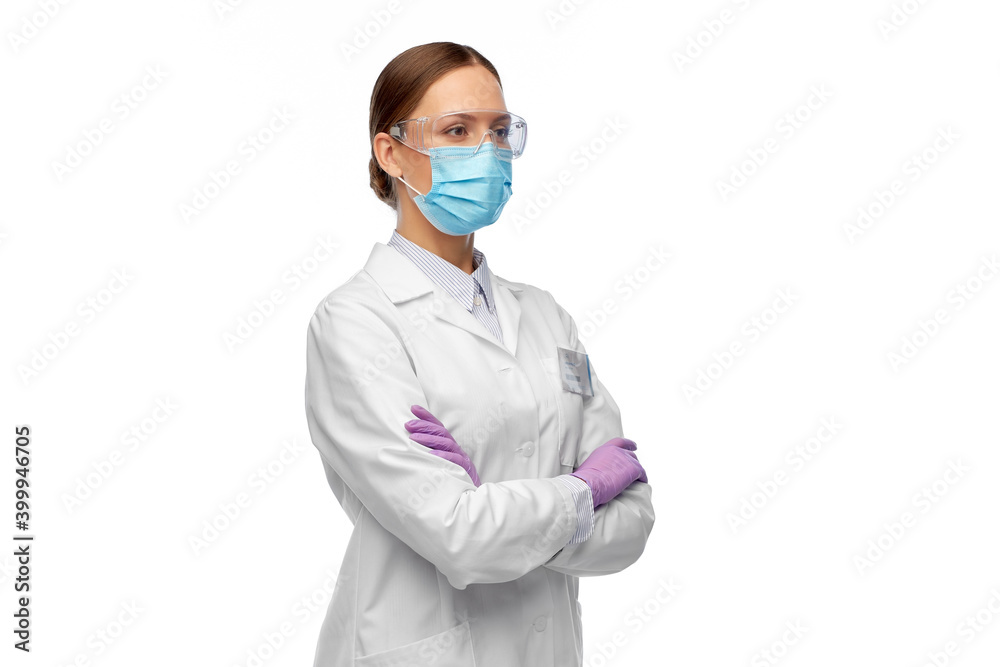 science, health and medicine concept - young female scientist wearing goggles and face protective medical mask for protection from virus