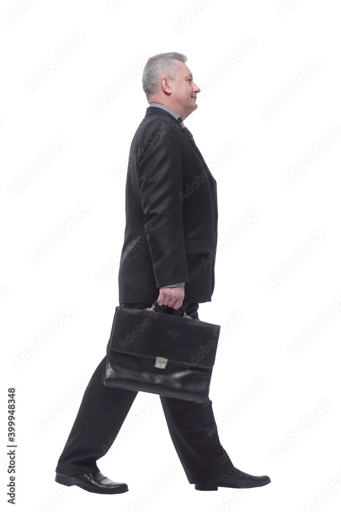 Side view business man walking with briefcase Side view business man walking with briefcase