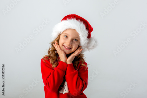 girl in a santa hat on a white background
