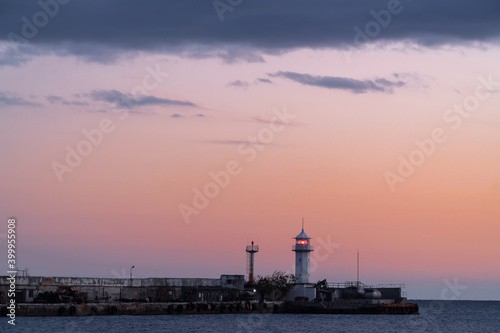 Yalta lighthouse against the background of a pink evening sky