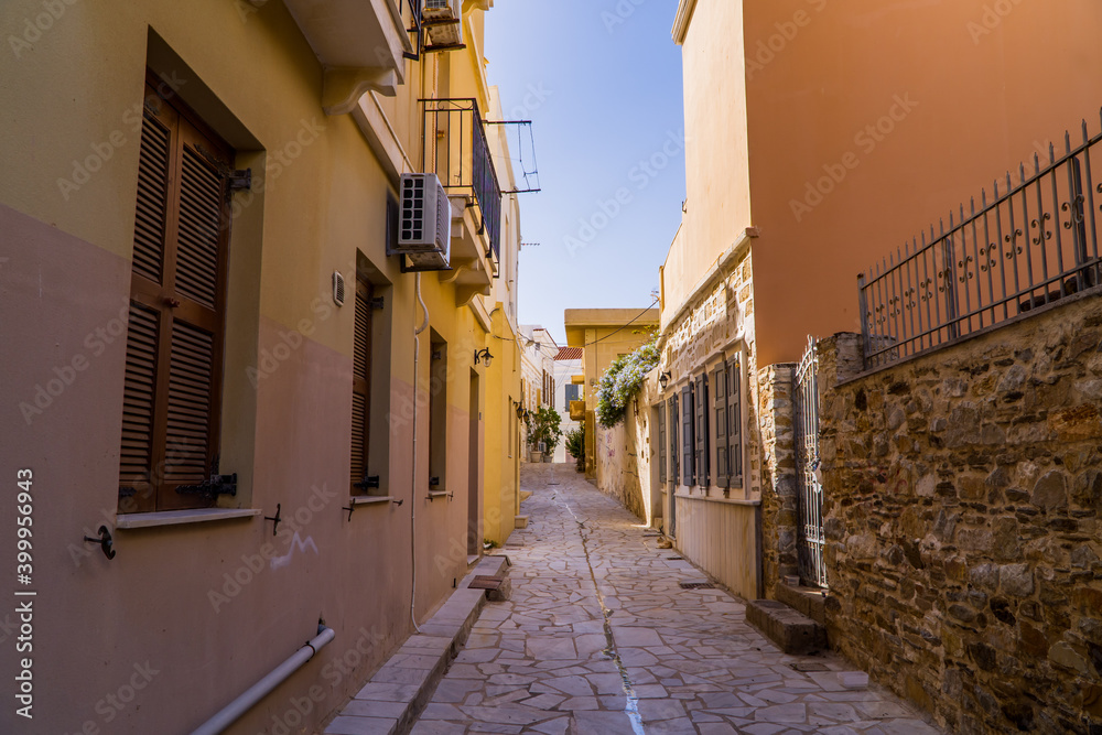Traditional alley with marble floor ancient buildings in the old town of Ermoupolis on the Greek island of Syros - Cyclades, Greece