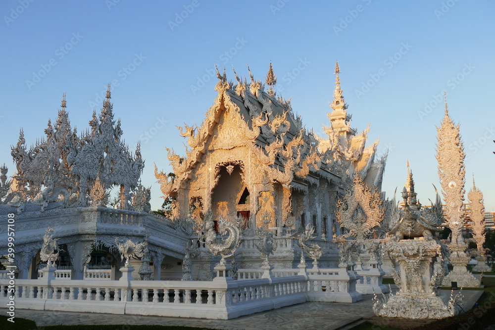 Magnificently grand white church and reflection in the water, Rong Khun temple, Chiang Rai province, northern Thailand