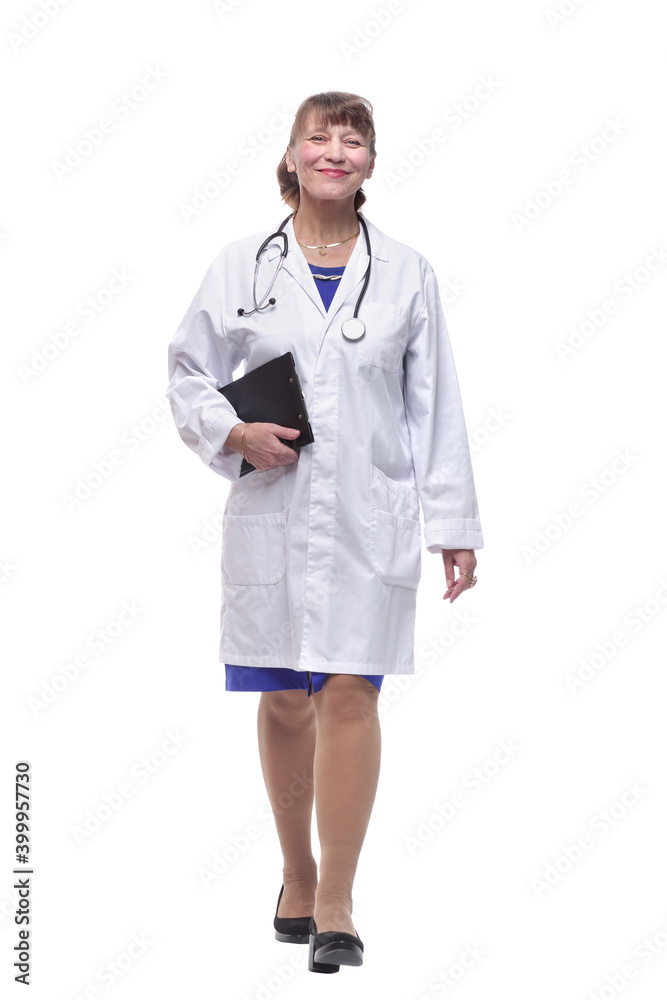 Portrait of attractive female doctor walking and smiling at camera Portrait of attractive female doctor walking and smiling at camera