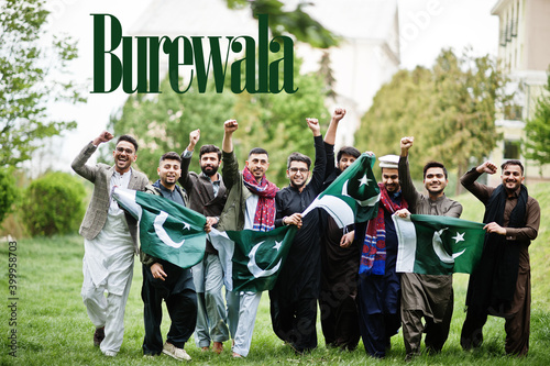 Burewala city. Group of pakistani man wearing traditional clothes with national flags. Biggest cities of Pakistan concept.