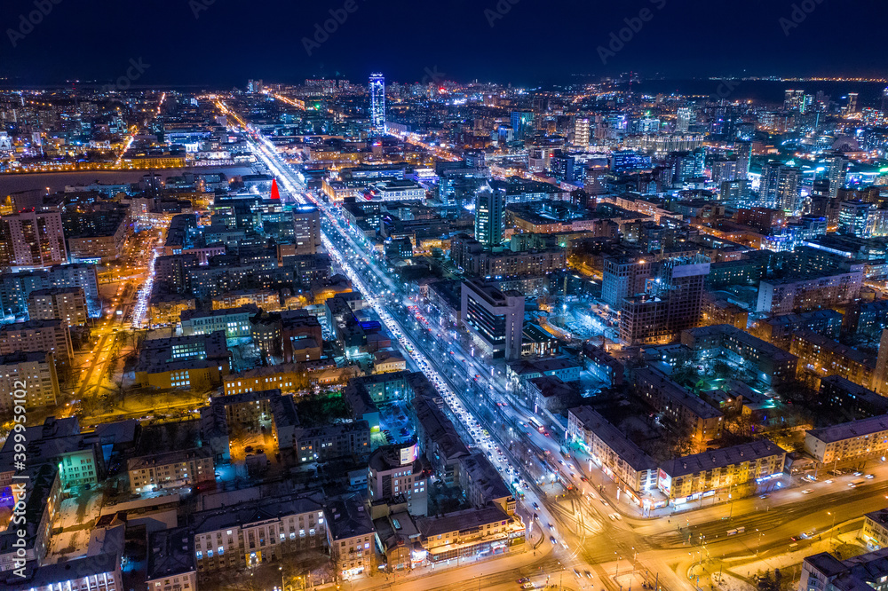 Aerial view of the night modern city. Bright lights of the night streets. Ekaterinburg. Russia