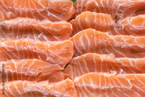  fresh slices salmon fillet on plate to make Salmon Sashimi