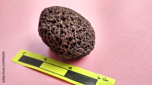 Oxide pumice speciment, brown, rounded and weighs light , is a volcanic rock that consists of highly vesicular rough textured glass, crystals. Central Java