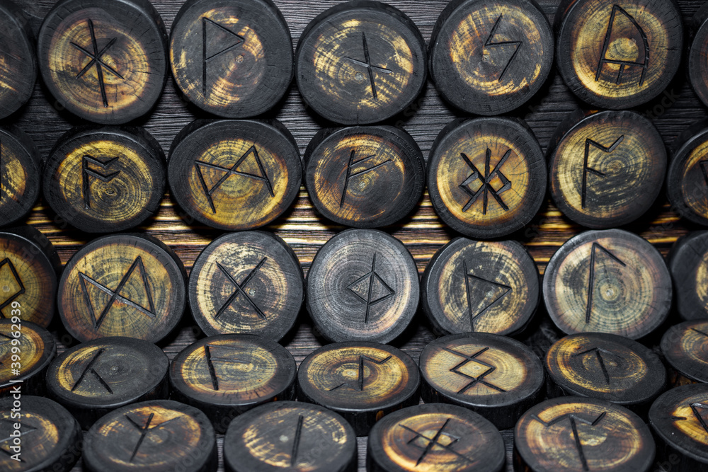 Runes carved from wood on the vintage wood background, Anglo-Saxons Futhark
