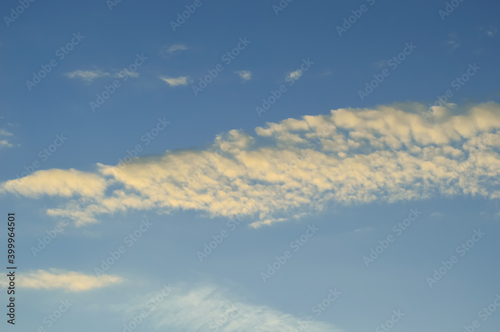close-up - blue sky and small clouds at sunset close-up - blue sky and small clouds at sunset