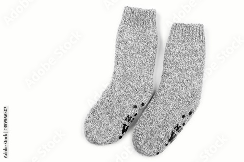 Gray warm knitted wool socks handmade pair for cold winter, isolated