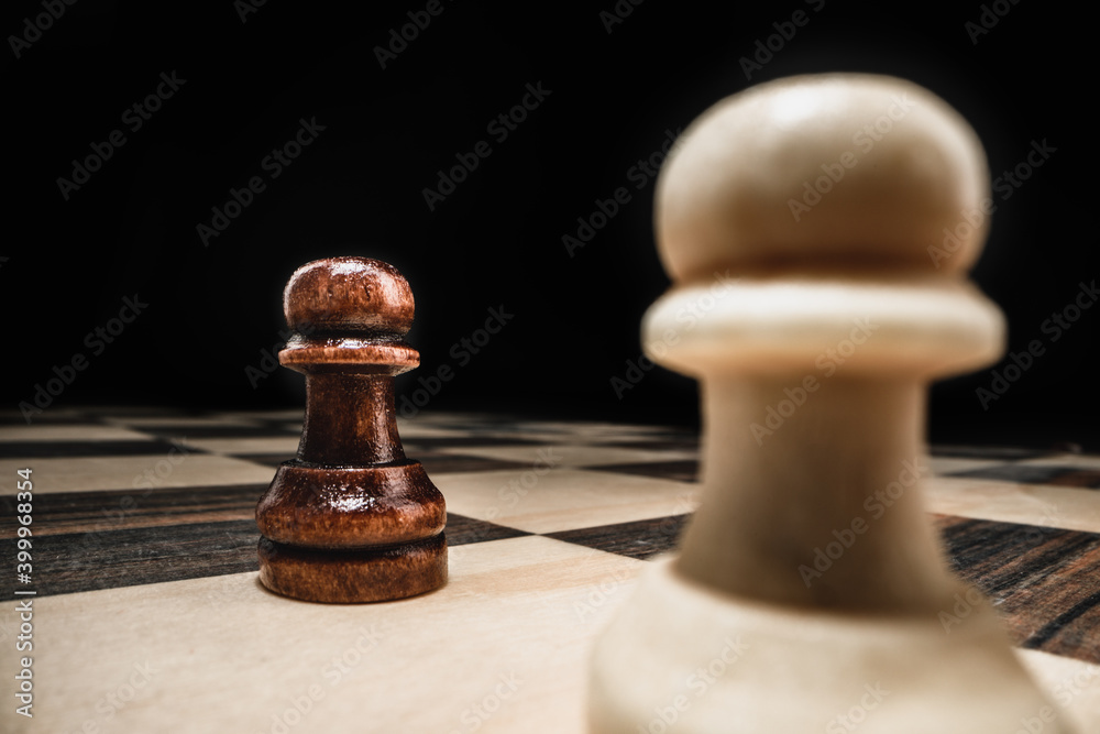 Chess game with chess pieces against black background Chess game with chess pieces against black background