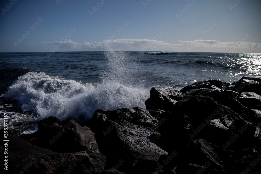 waves crashing on rocks