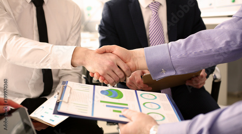 Fotografía Close-up of young manager giving important business project that determine future of corporation