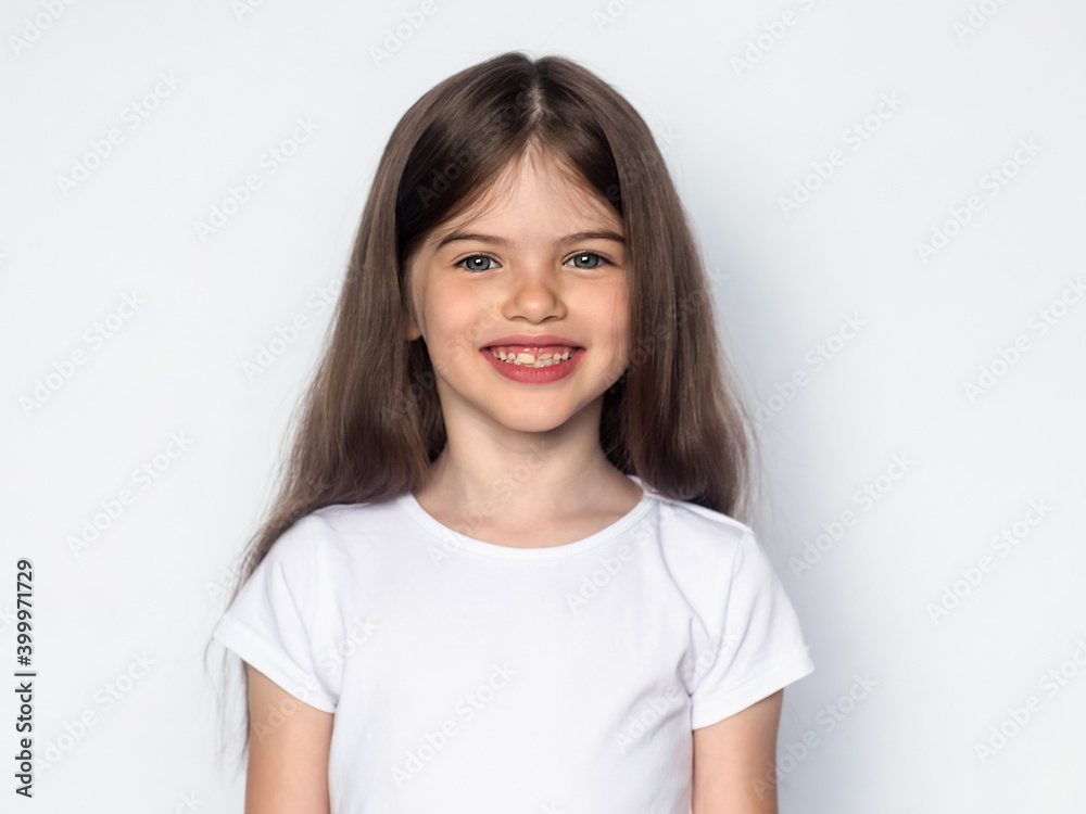t-shirt design concept - cute smiling happy little girl in blank white t-shirt t-shirt design concept - cute smiling happy little girl in blank white t-shirt