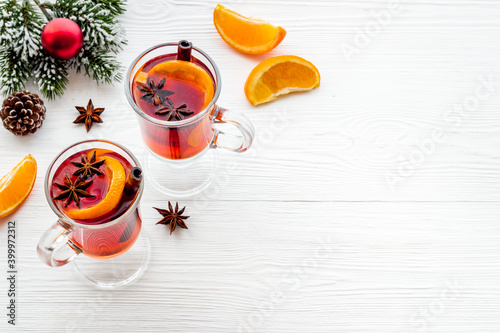 Christmas mulled wine with ingredients and Christmas decoration