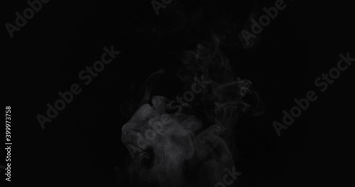 White natural rising steam from food or hot drink isolated on a black background. Сan be used in any projects with hot food. Slow motion, 4K, 300fps, Blackmagic Ursa Pro G2. photo