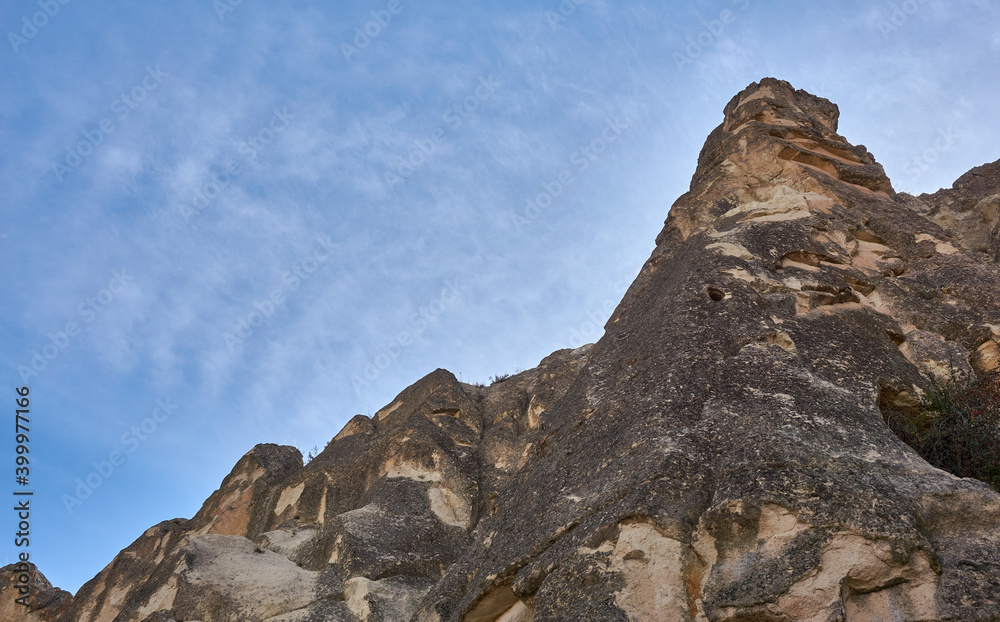 Ancient cave houses and rock formations near Goreme, Cappadocia, Turkey Ancient cave houses and rock formations near Goreme, Cappadocia, Turkey