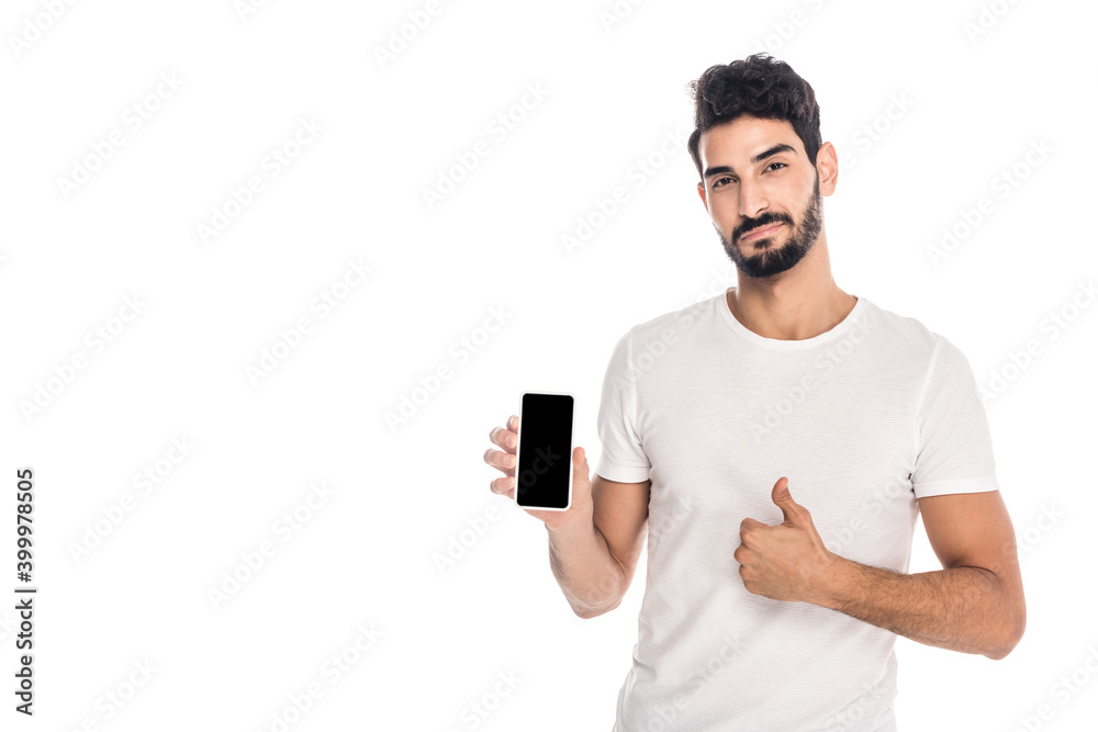 young hispanic man showing thumb up while holding smartphone with blank screen isolated on white young hispanic man showing thumb up while holding smartphone with blank screen isolated on white