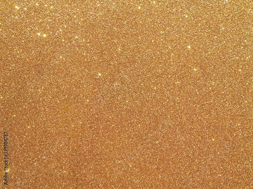 Defocused background of abstract gold glitter lights 