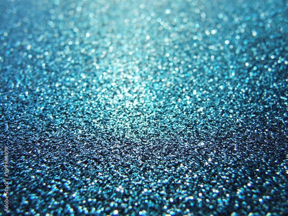 Defocused background of abstract blue and gold glitter lights
Defocused background of abstract blue and gold glitter lights