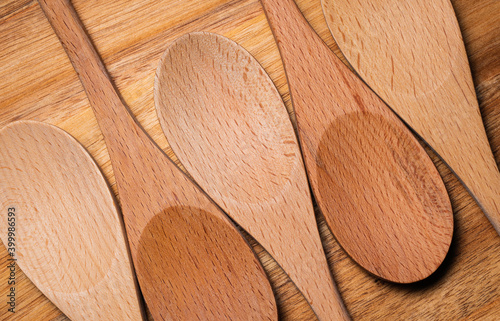 Repeating Wooden Spoons on Wood Background