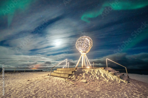 The Northern Lights (Aurora Borealis) over the Globe Monument, symbol of North Cape (Nordkapp), Mageroya island, Troms og Finnmark photo
