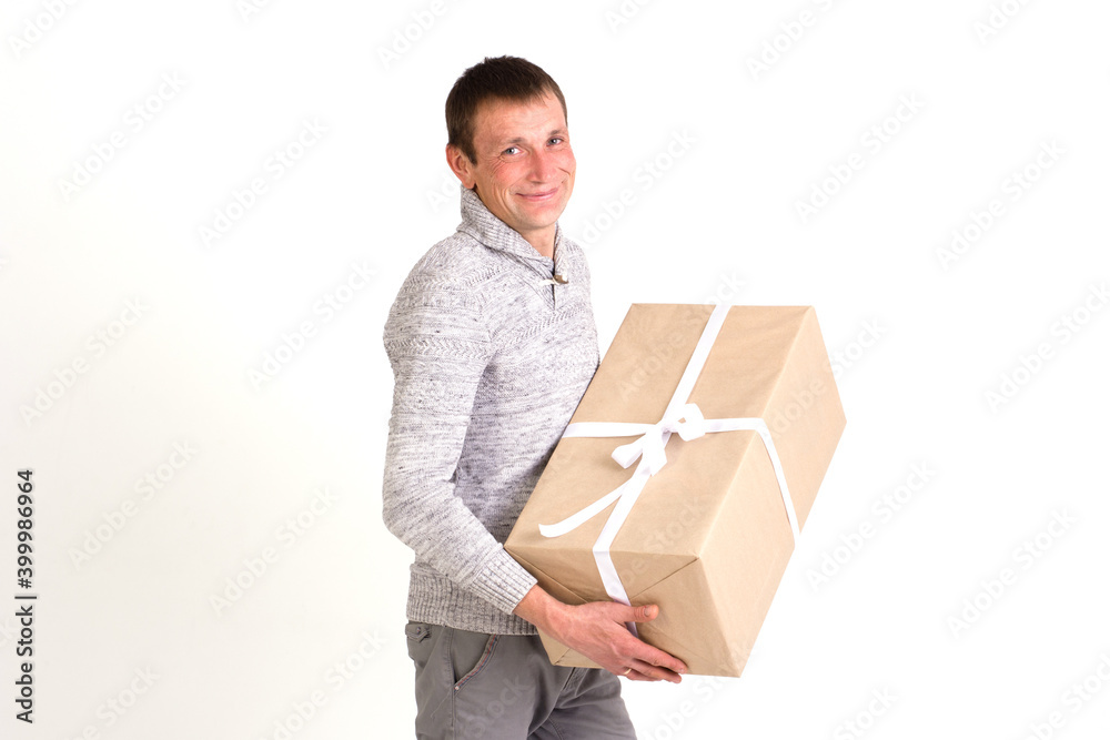 Handsome smiling man with big gift on white background Handsome smiling man with big gift on white background