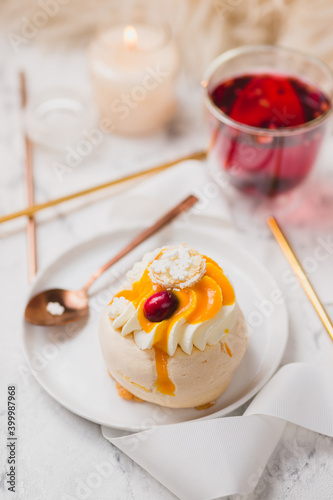 Festive dessert table. Mini pavlova with mango mousse and mulled wine.