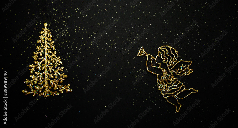 New Year tree and angel on a black background. A festive gift for Christmas. Golden toy for the Christmas tree. Beautiful background for your desktop. High quality photo New Year tree and angel on a black background. A festive gift for Christmas. Golden toy for the Christmas tree. Beautiful background for your desktop. High quality photo