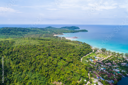 Sea beach with resort resident and coconut palm tree aerial view
