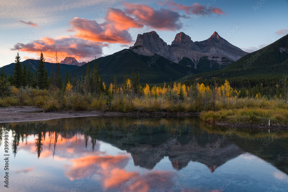 Sunrise in autumn at Three Sisters Peaks near Banff National Park, Canmore, Alberta, Canadian Rockies, Canada Sunrise in autumn at Three Sisters Peaks near Banff National Park, Canmore, Alberta, Canadian Rockies, Canada