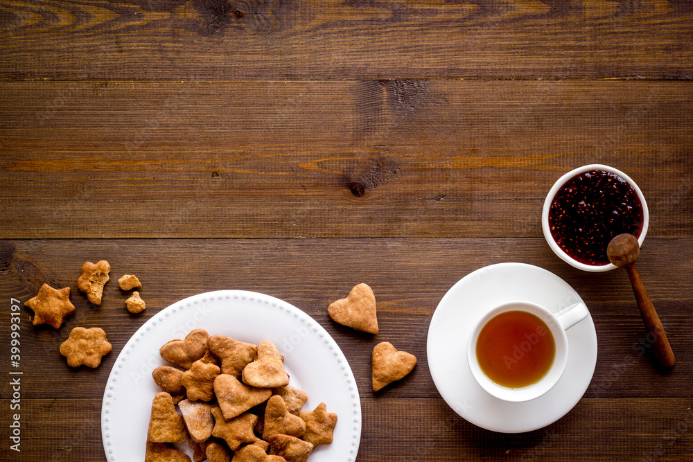Tea with cookies and berry jam at home top view Tea with cookies and berry jam at home top view
