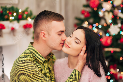 couple in love together in a cozy winter interior