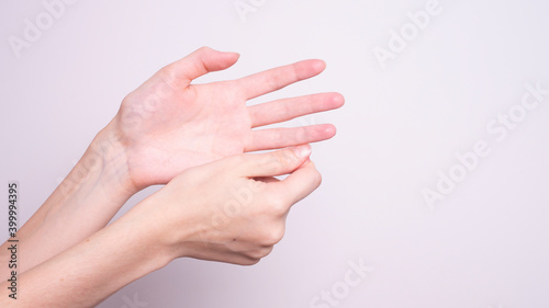 Parkinson s disease symptoms. Close up of tremor  shaking  hands of Middle-aged women patient with Parkinson s disease. Mental health and neurological disorders.