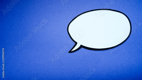 paper speech bubble on blue background