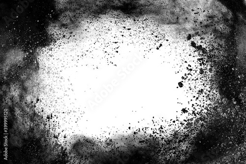particles of charcoal on white background, abstract powder splatted on white background, Freeze motion of black powder exploding or throwing black powder.