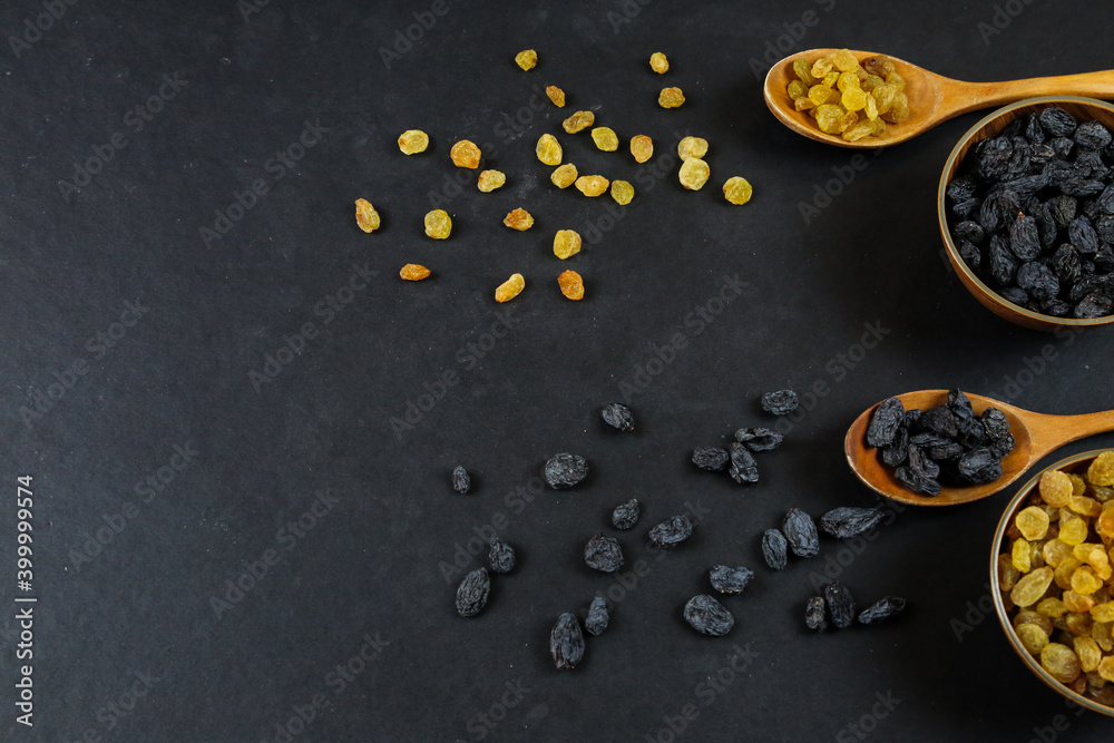 Dried raisins on black background Dried raisins on black background