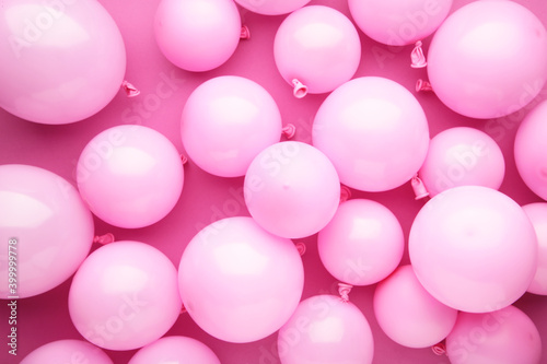 Many pink balloons decorated wall as background.